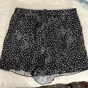 Black and white polka dot shorts with ruffle on the bottom.